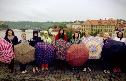 Study Abroad students with umbrellas
