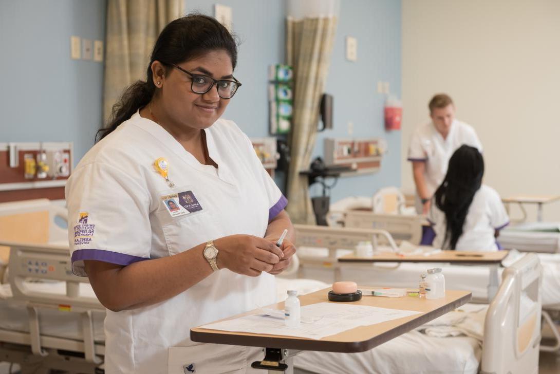 Nursing student prepares syringe tray