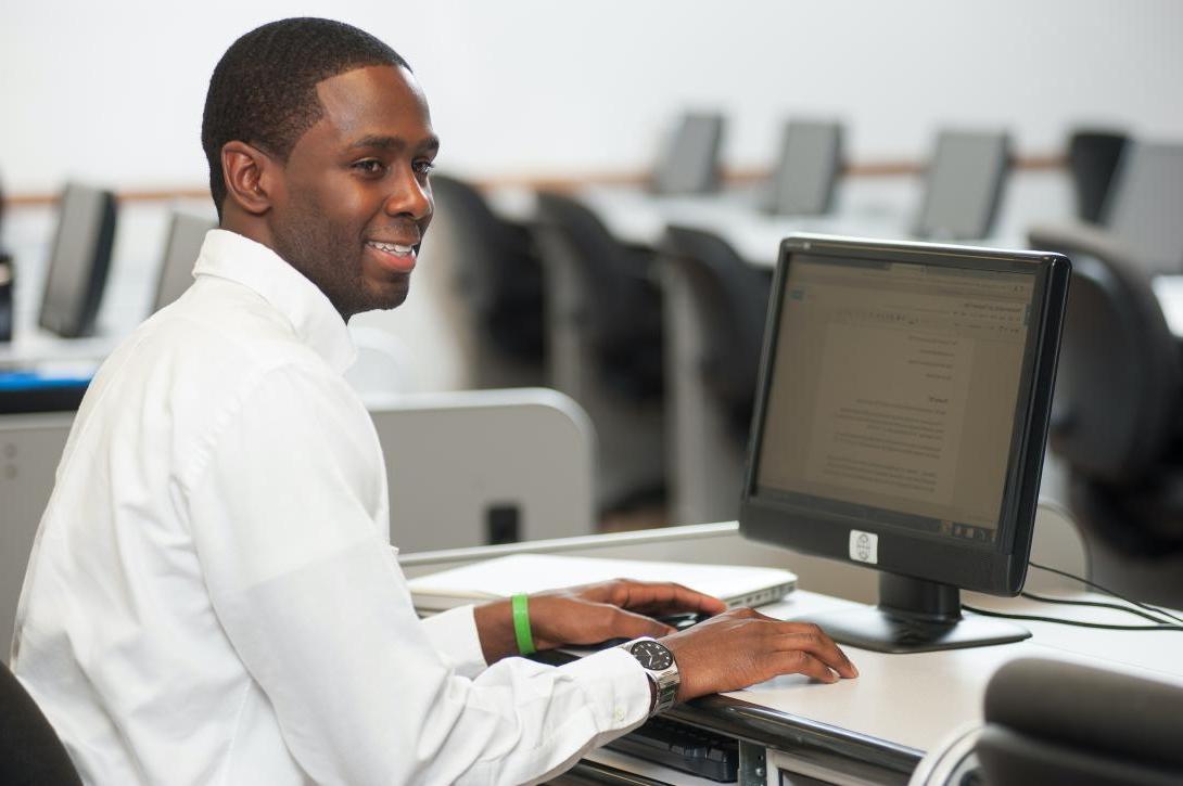 Graduate student sitting at computer