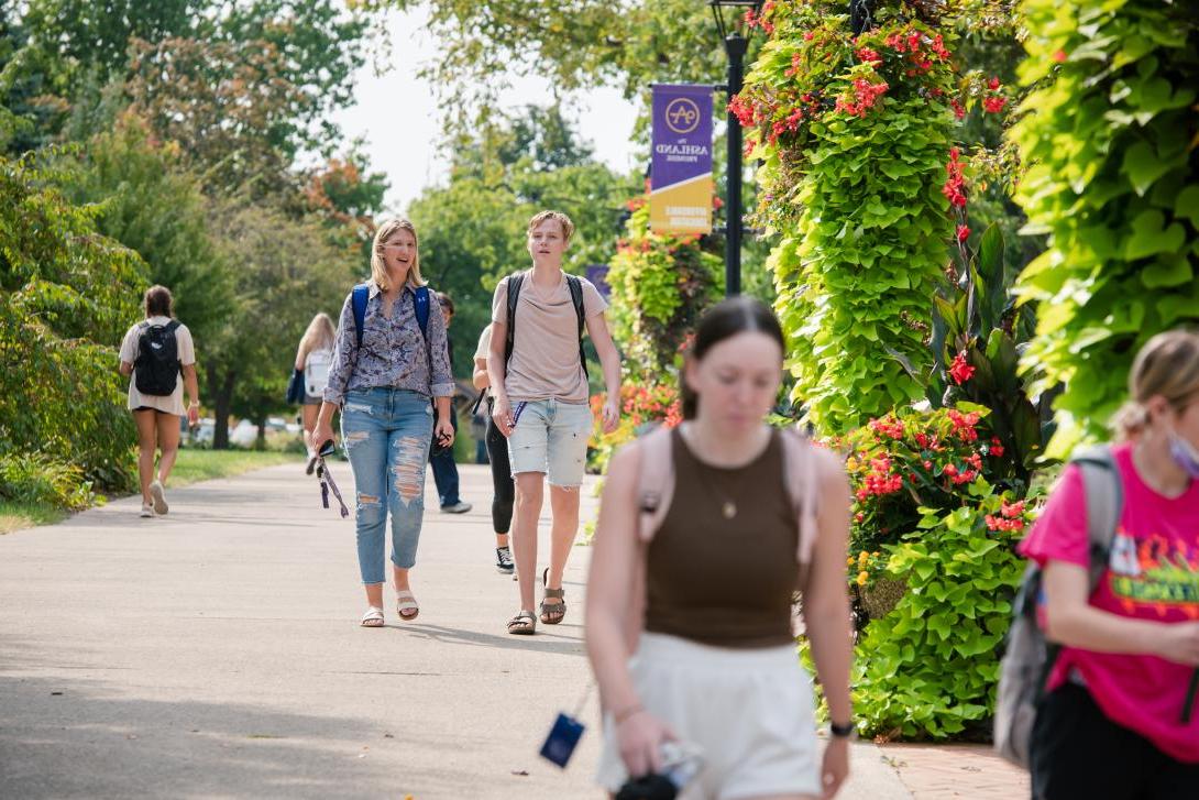 Students walking on the Avenue of Eagles