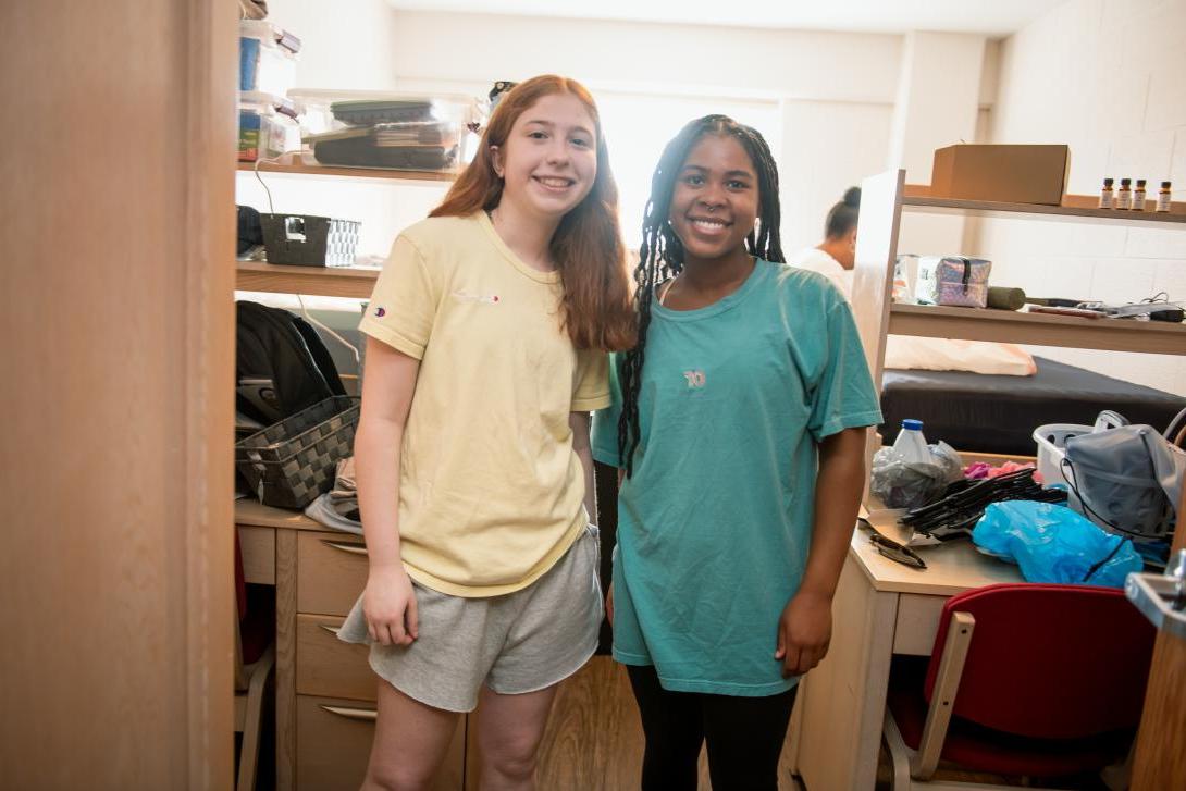 Students in their dorm at moving